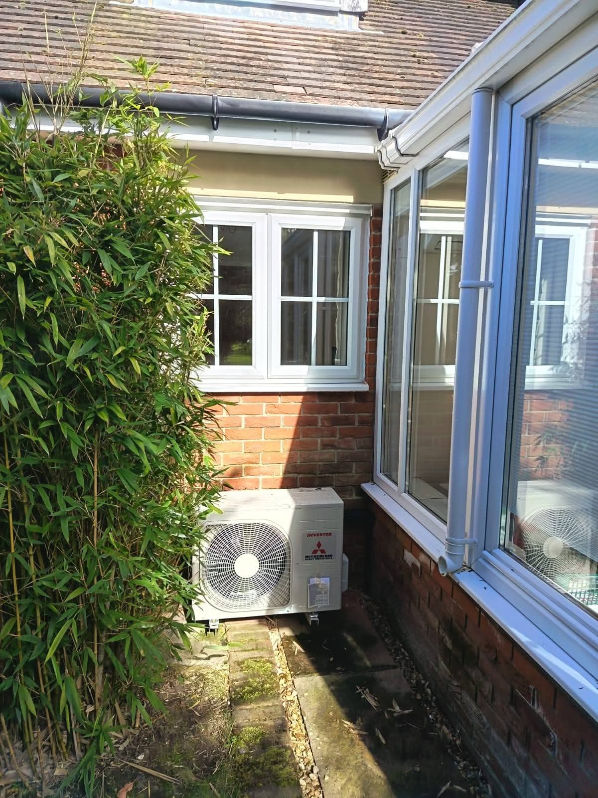 Wall-mounted split air conditioning unit in a Hampshire living room