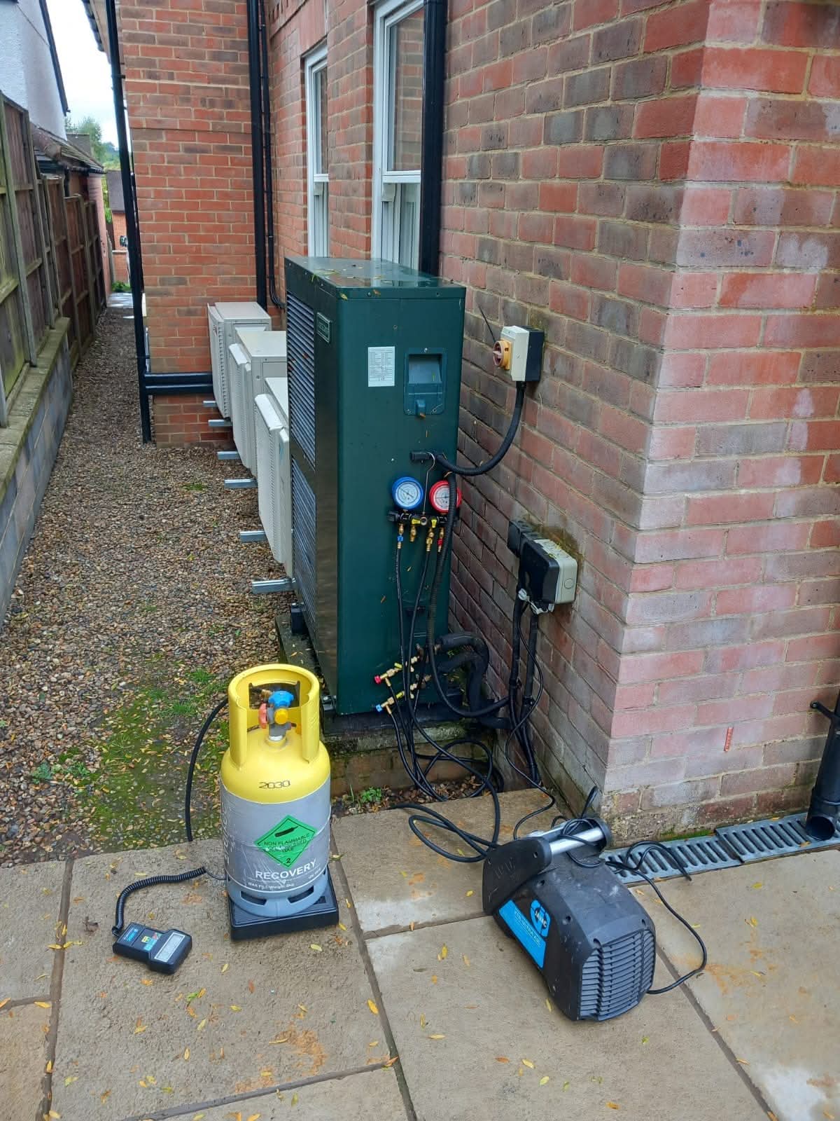 Commercial air conditioning maintenance with filters removed for F-Gas inspection
