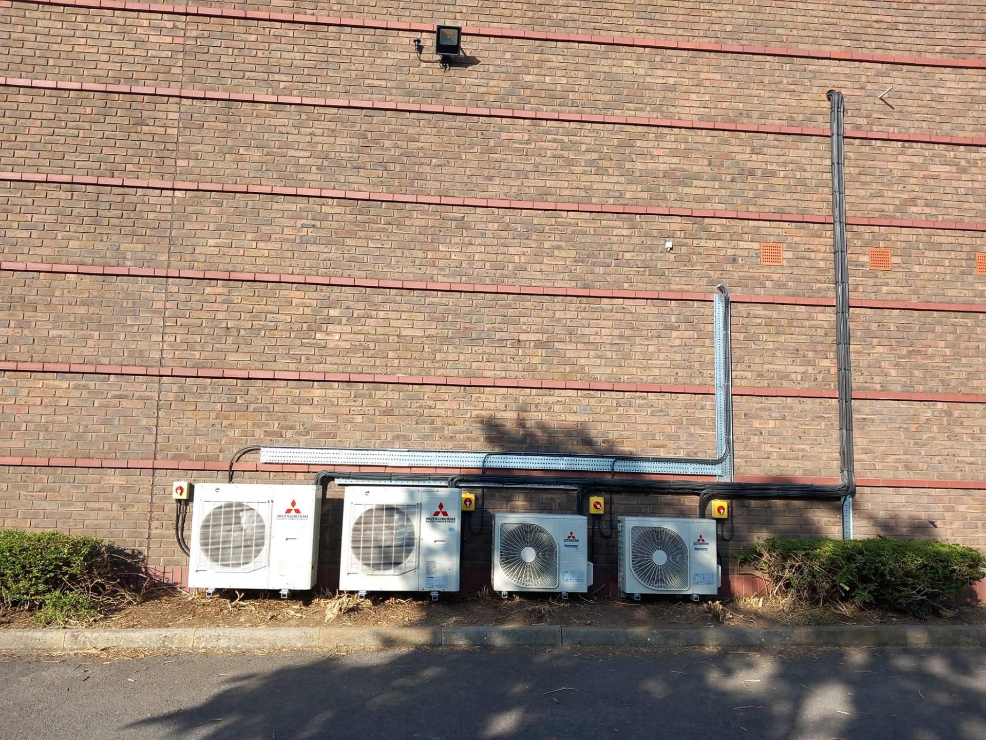Commercial air conditioning condensers installed at industrial building